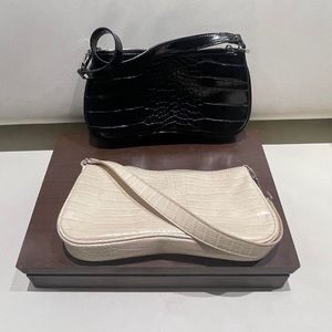 Black and white (2x) handbag croc bags.